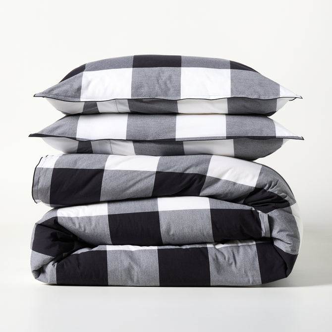 Diane Keaton + Hudson Grace black and white buffalo check percale duvet and shams set, folded.