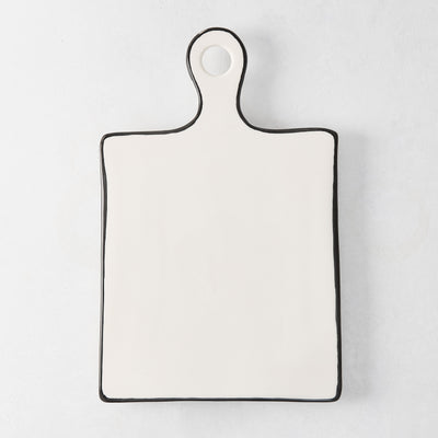 Diane Keaton + Hudson Grace ceramic cheese board with black trim and rounded handle.
