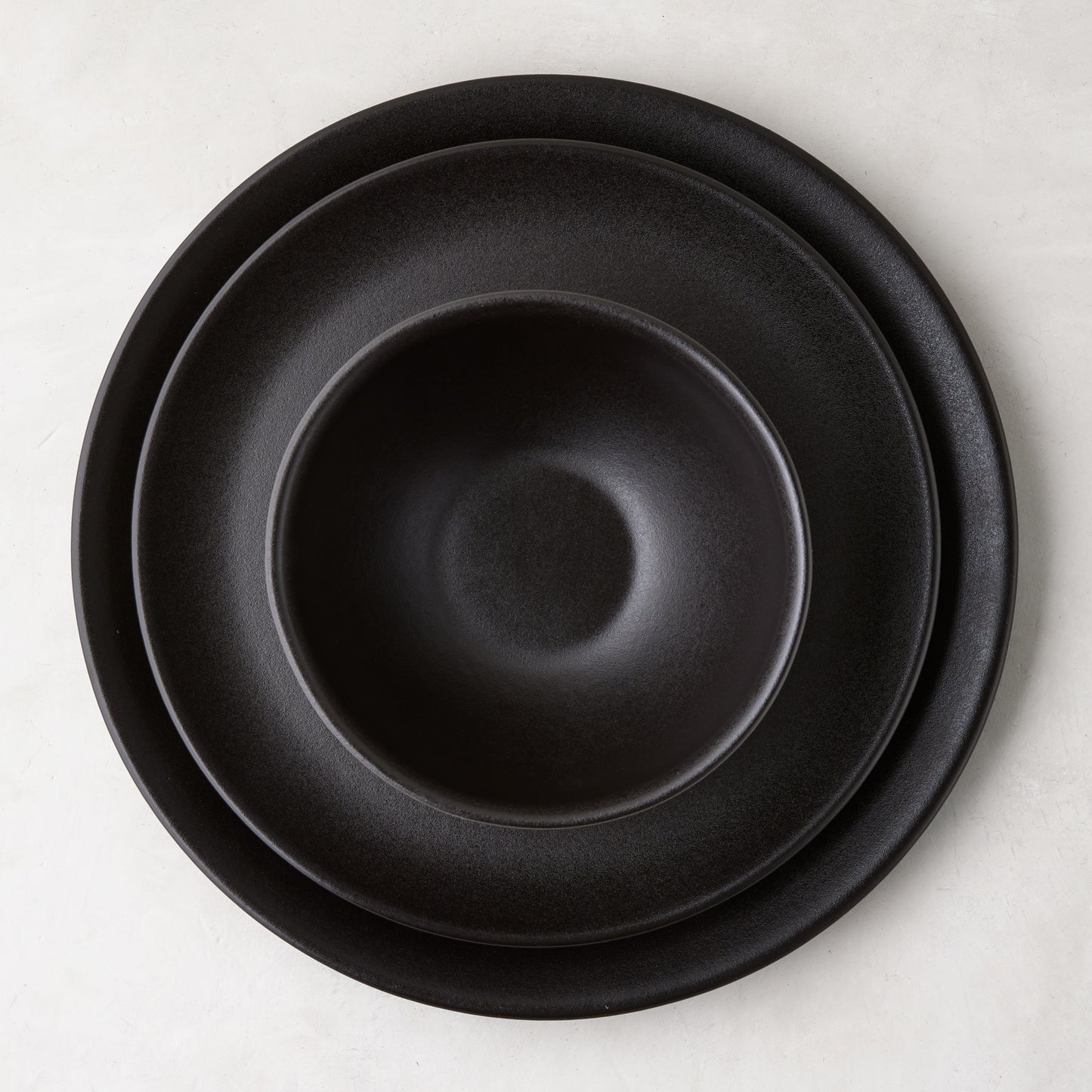 Diane Keaton + Hudson Grace Chalkboard matte black stoneware dinner plate, salad plate, and bowl set.