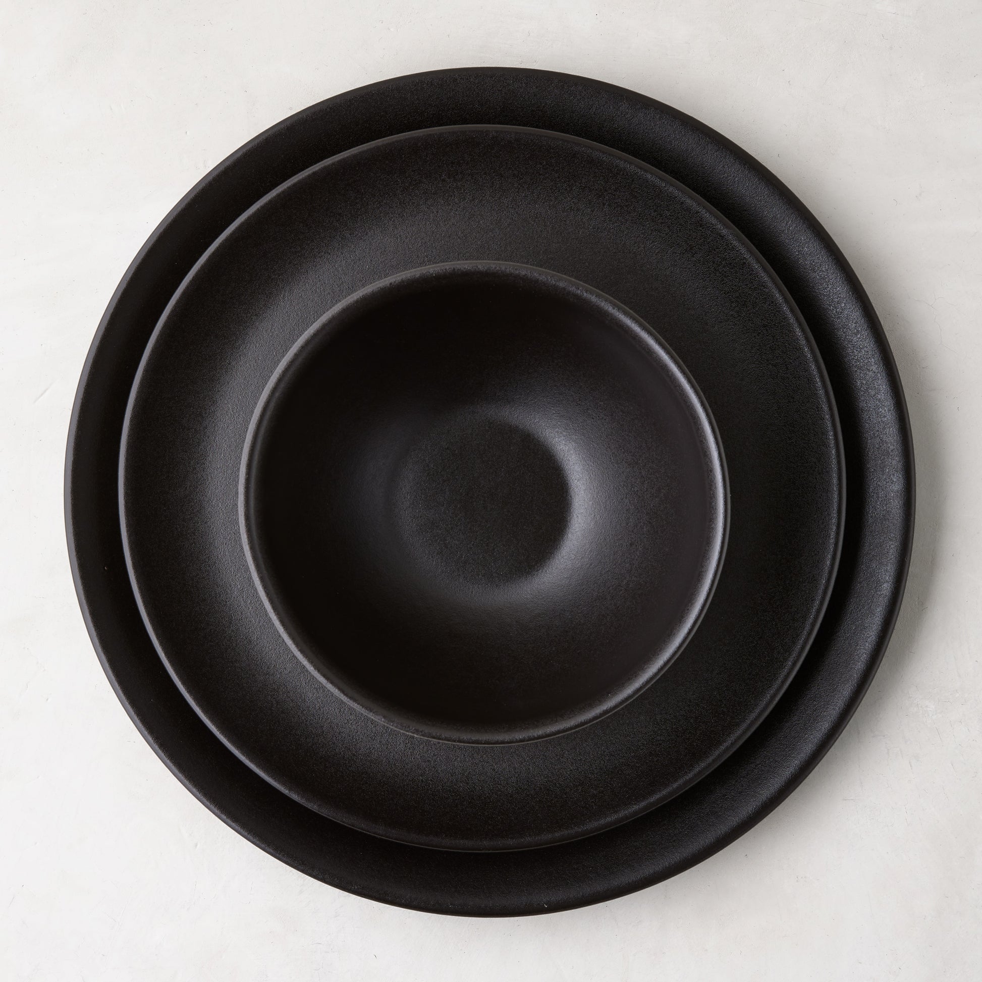 Diane Keaton + Hudson Grace Chalkboard matte black stoneware dinner plate, salad plate, and bowl set.