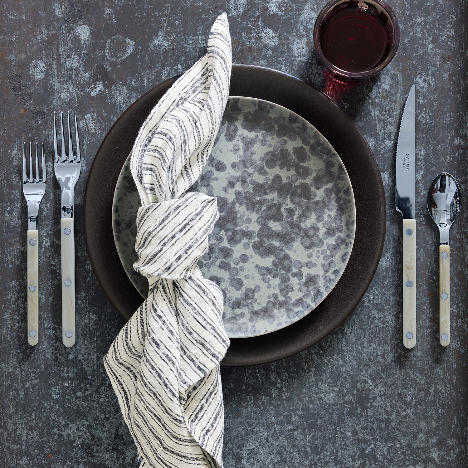 Diane Keaton x Hudson Grace Composition Splatter Stoneware Dinner Plate, black and grey splatter pattern.