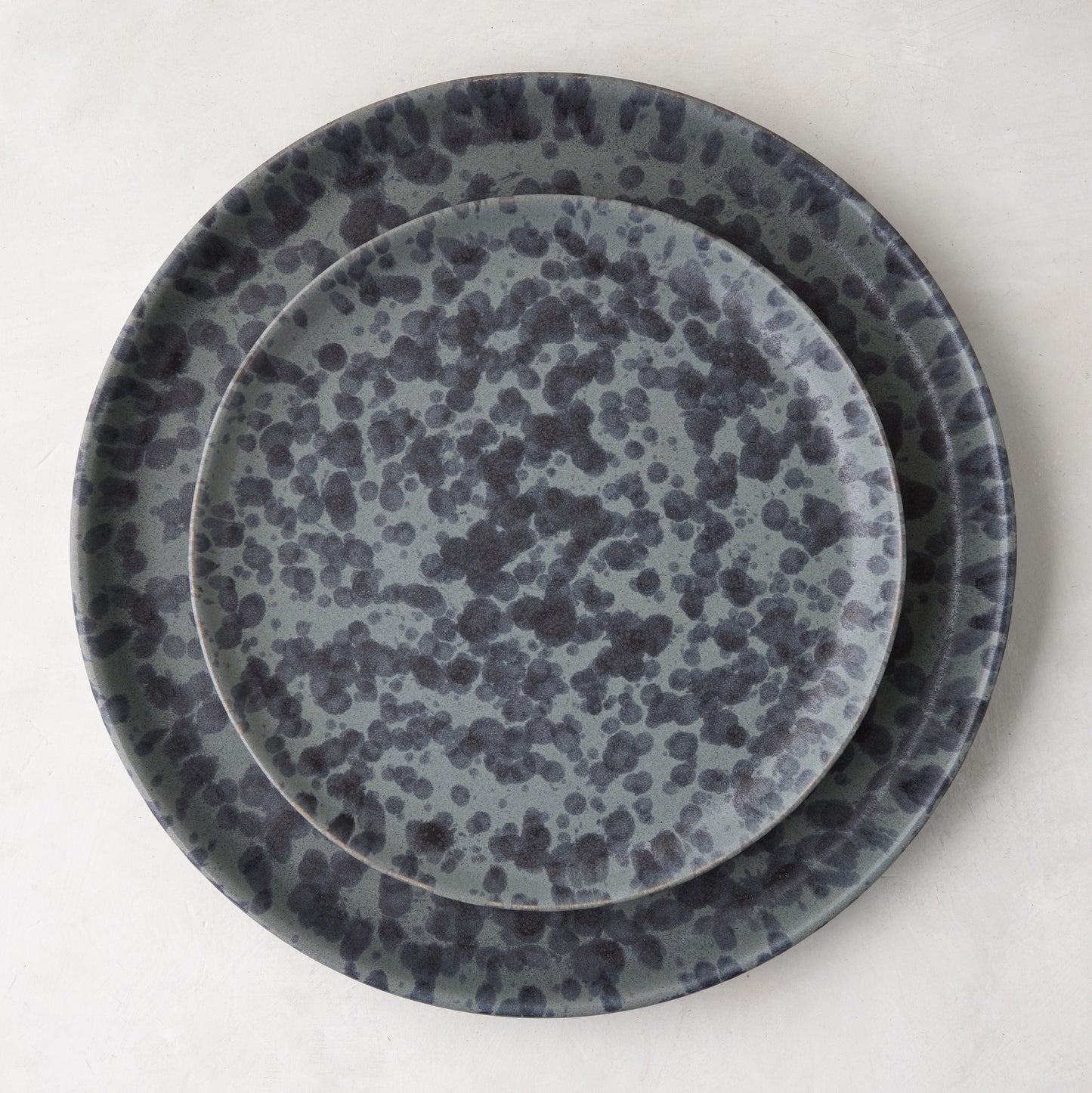Diane Keaton x Hudson Grace Composition Splatter Stoneware Dinner Plate, black and grey splatter pattern.