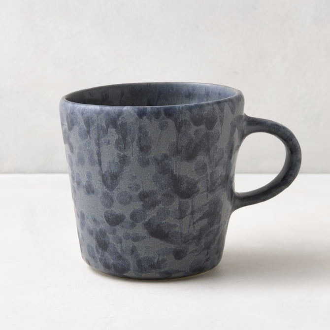 Diane Keaton + Hudson Grace black and grey splatter stoneware mug.