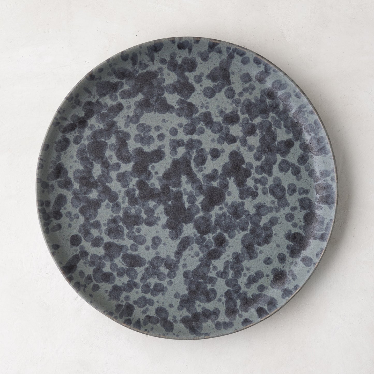 Diane Keaton + Hudson Grace Composition Splatter Stoneware Salad Plate, black and grey splatter pattern.