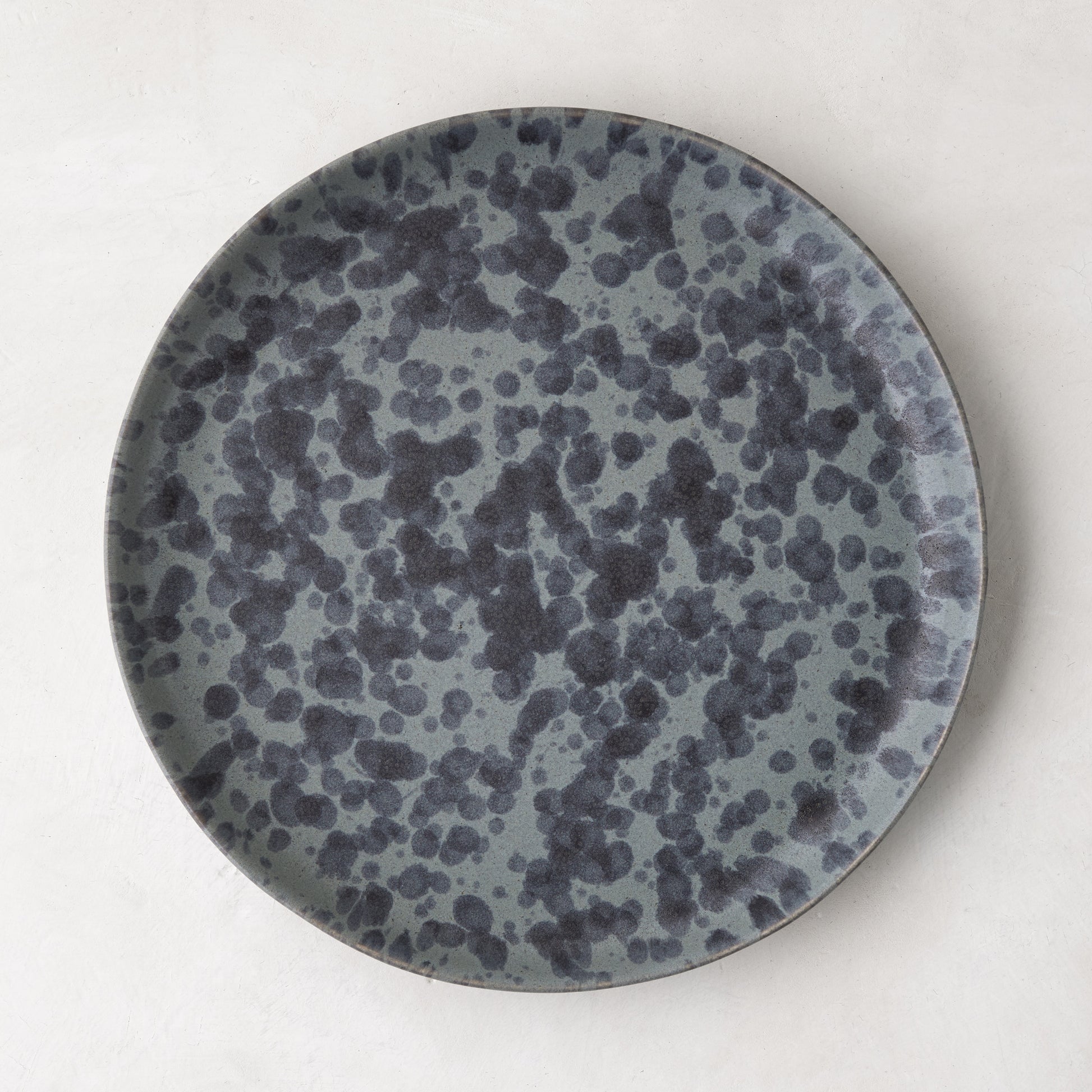 Diane Keaton + Hudson Grace Composition Splatter Stoneware Salad Plate, black and grey splatter pattern.