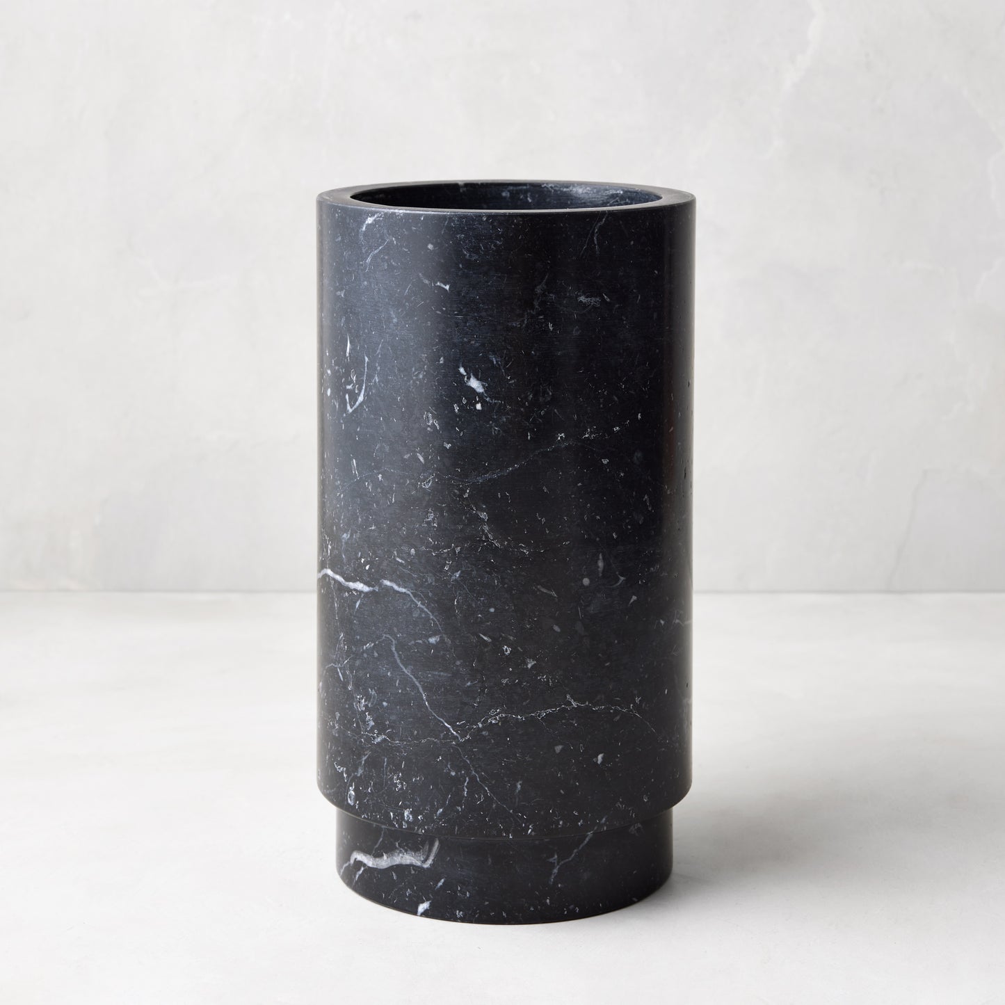 Diane Keaton + Hudson Grace Deco black marble wine chiller, cylindrical with white veining.