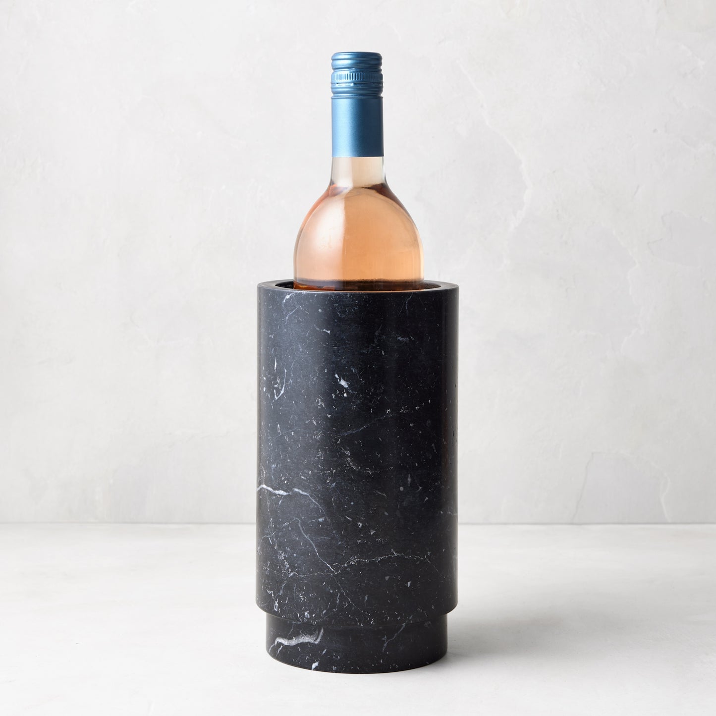 Diane Keaton x Hudson Grace Deco Black Marble Wine Chiller with a rosé bottle.