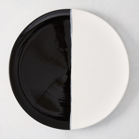 Diane Keaton + Hudson Grace Domino Half-Dipped Round Serving Platter, black and white ceramic.