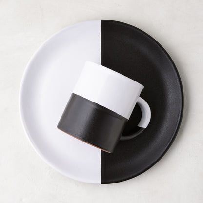 Diane Keaton + Hudson Grace Domino half-dipped black and white stoneware mug and plate set.