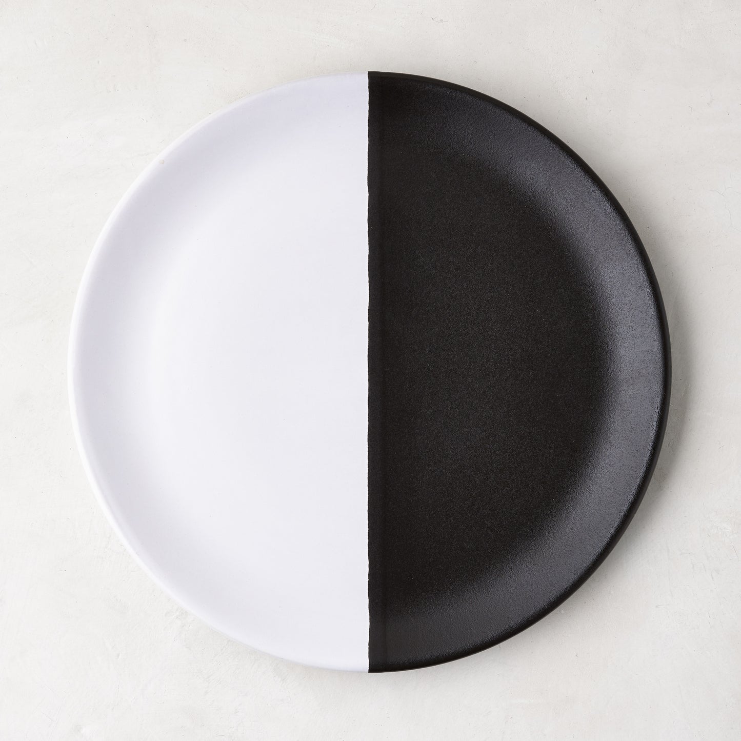 Diane Keaton + Hudson Grace Domino half-dipped black and white stoneware salad plate.