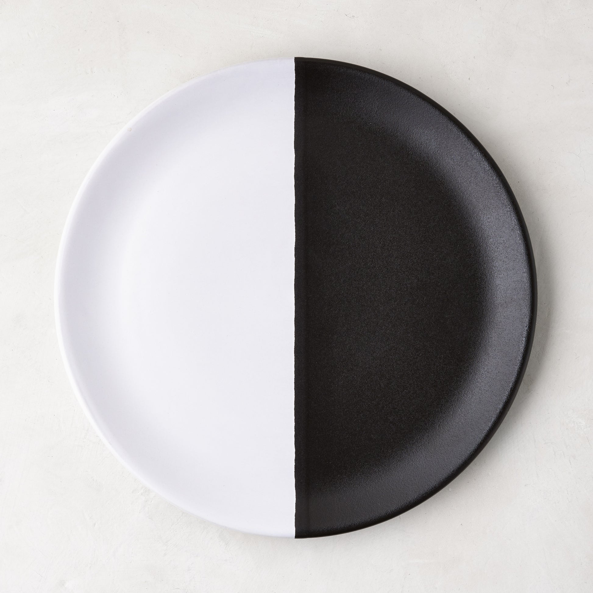 Diane Keaton + Hudson Grace Domino half-dipped black and white stoneware salad plate.