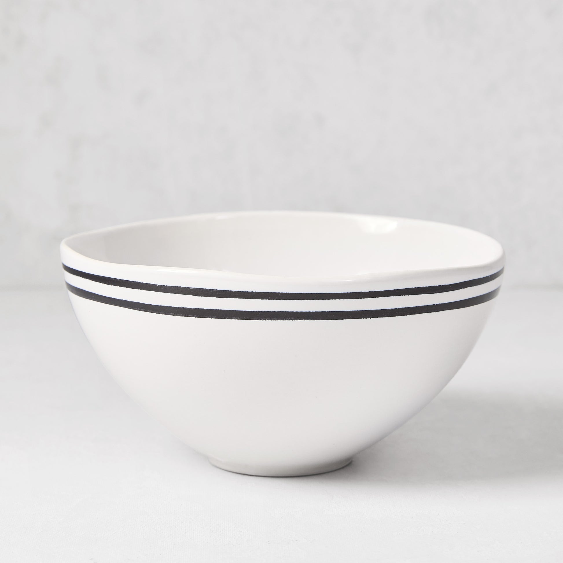 Diane Keaton + Hudson Grace Draft Collection white stoneware bowl with double black stripes.