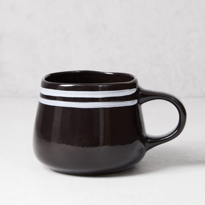 Diane Keaton + Hudson Grace Draft black stoneware mug with white double stripes.