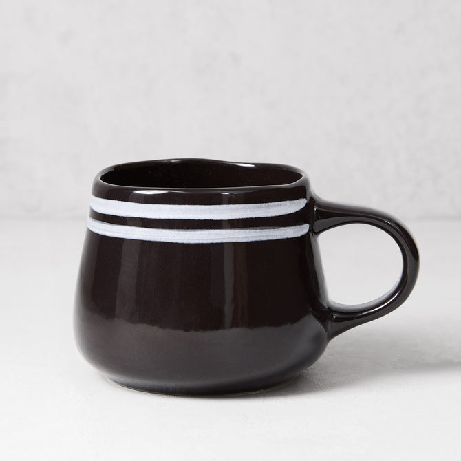 Diane Keaton + Hudson Grace Draft black stoneware mug with white double stripes.