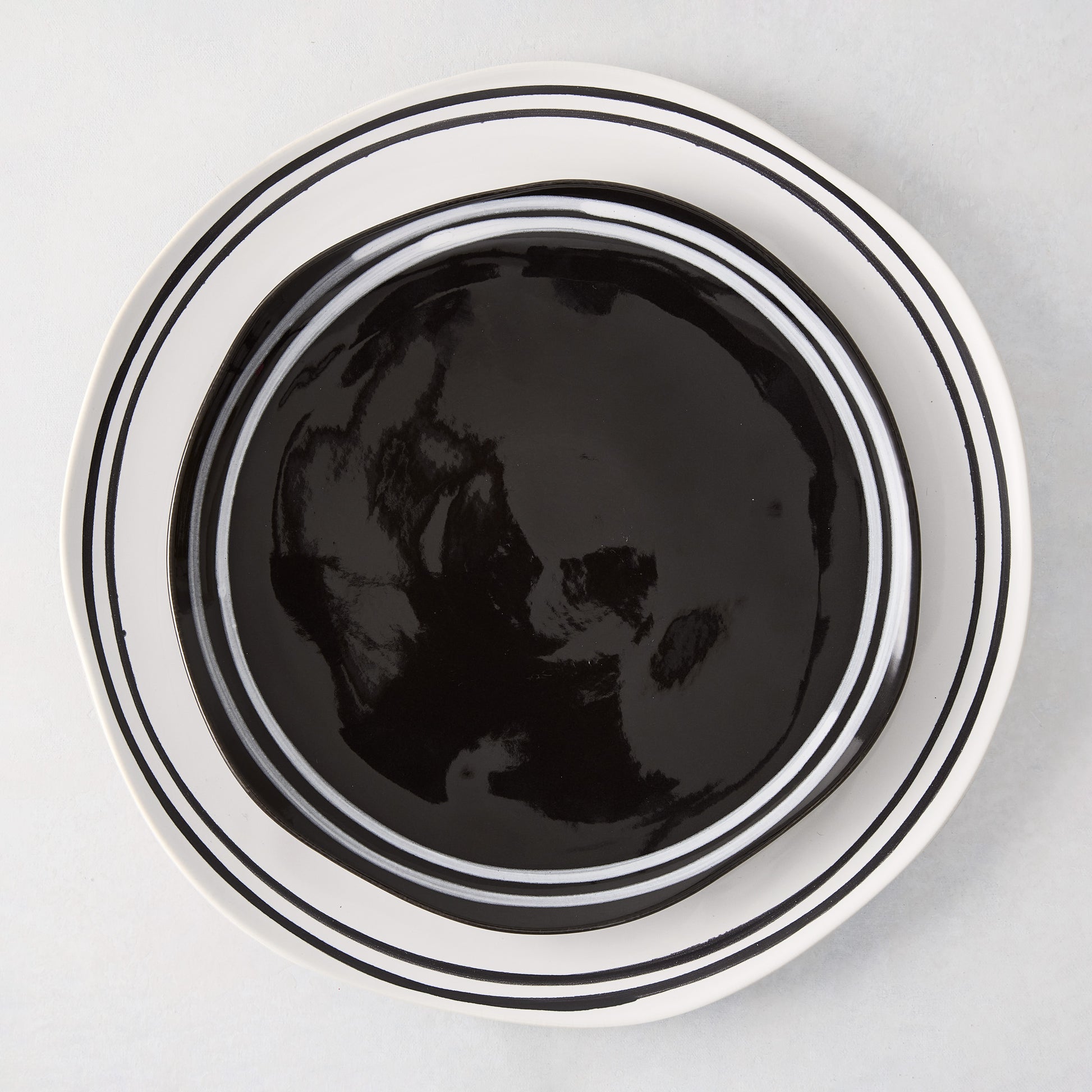 Diane Keaton + Hudson Grace Draft Collection black stoneware salad plate with white double stripe.