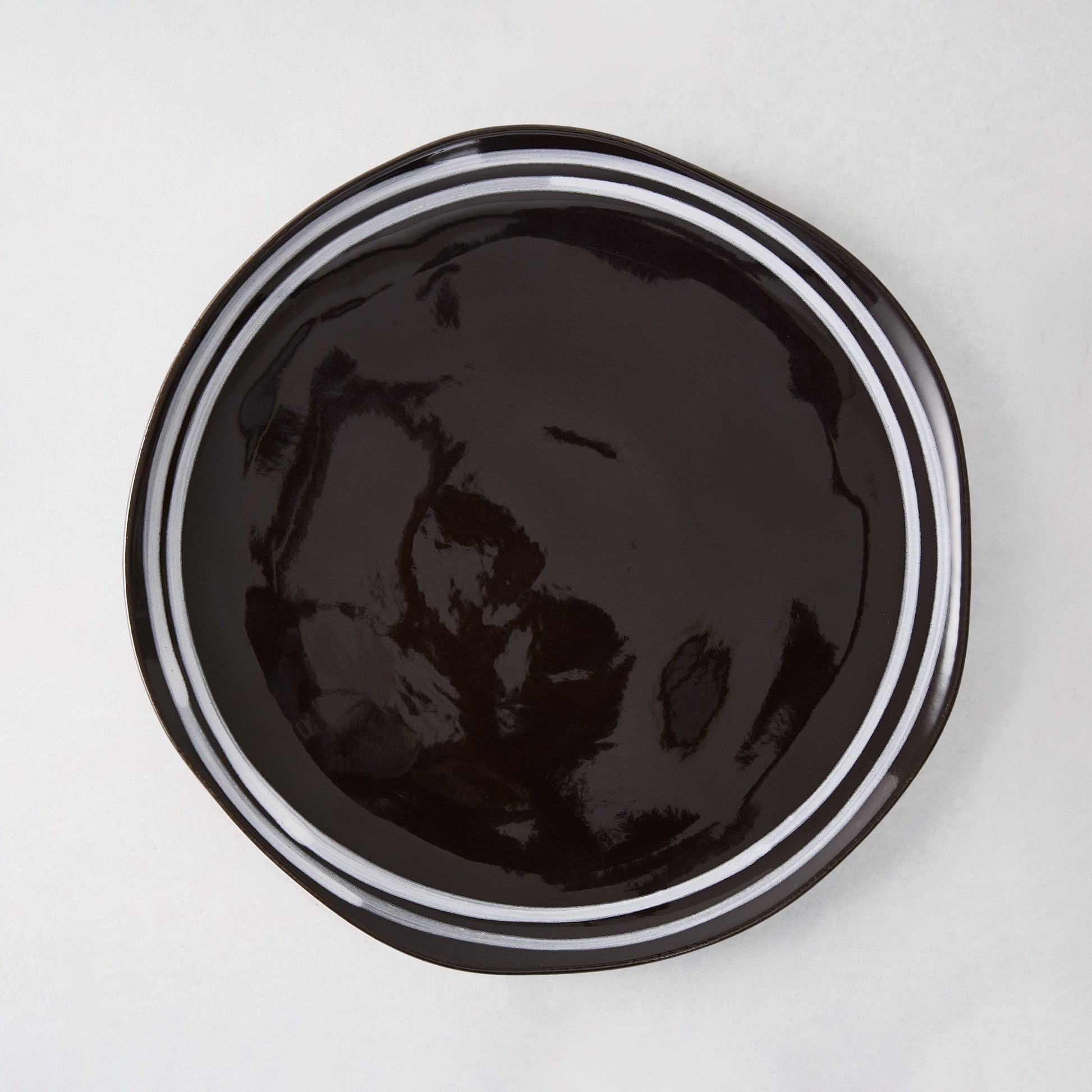 Diane Keaton + Hudson Grace Draft black stoneware salad plate with white double stripe.