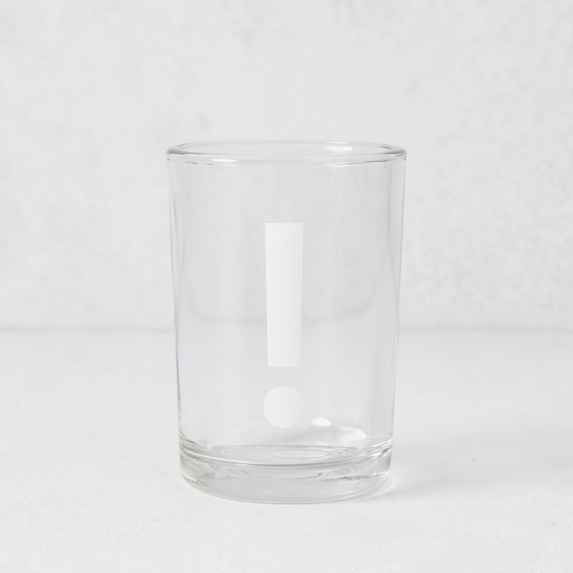 Clear glass Everyday Wine Glass with a white exclamation point design.
