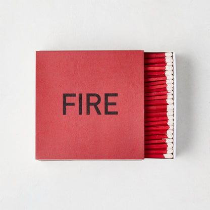 Diane Keaton x Hudson Grace "Fire" oversized boxed matches, red box with "FIRE" in black, red 4-inch matches visible.