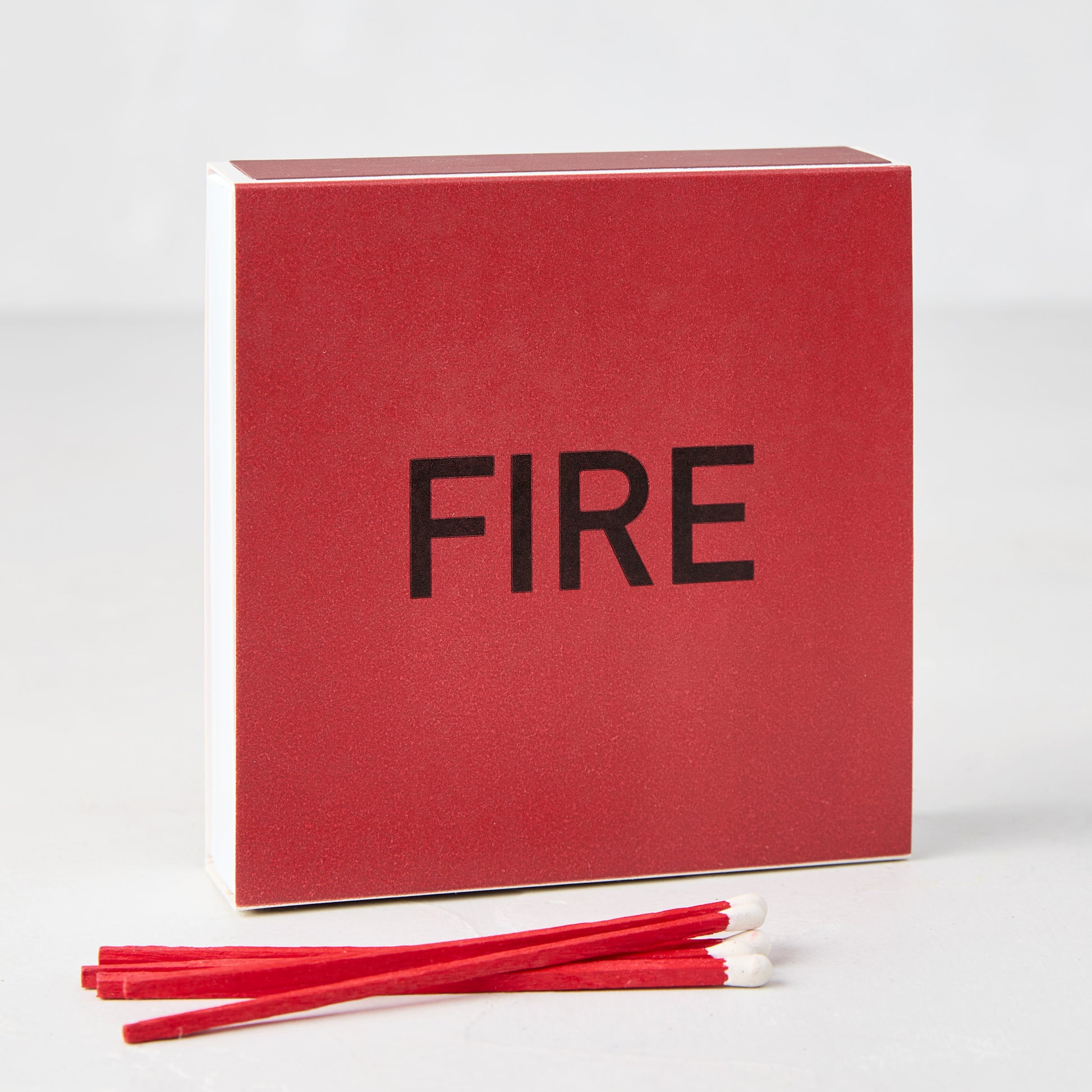 Diane Keaton x Hudson Grace "Fire" oversized red boxed matches with black text and several red matches.