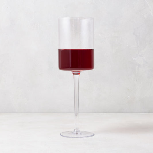 Diane Keaton + Hudson Grace High Rise Large Wine Glass, clear lead-free glass with red wine, modern straight-sided design.