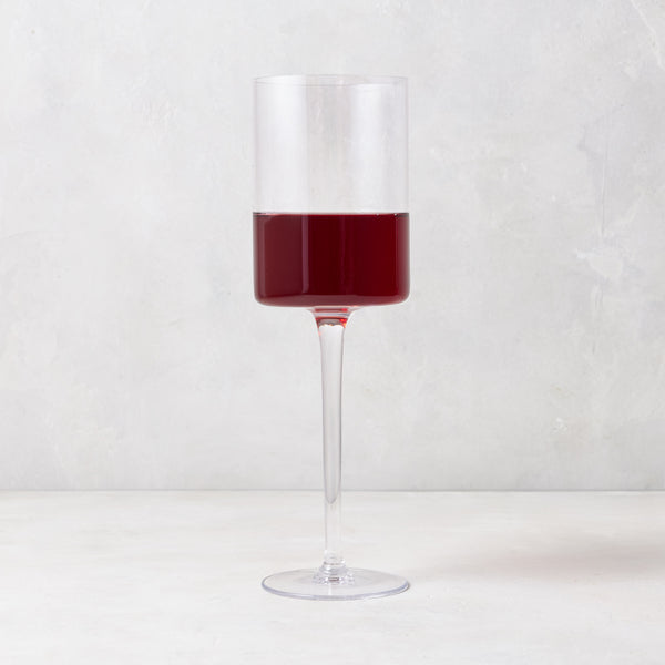 Diane Keaton + Hudson Grace High Rise Large Wine Glass, clear lead-free glass with red wine, modern straight-sided design.