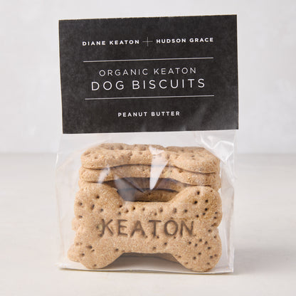 Diane Keaton + Hudson Grace "Keaton" organic peanut butter dog biscuits in a clear bag with a black label.