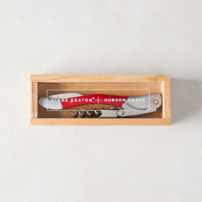 Diane Keaton + Hudson Grace "Keaton Red" wine corkscrew with red resin handle and stainless steel in a wooden gift box.