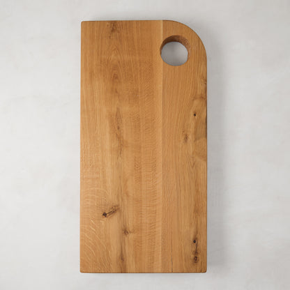 Large rectangular reclaimed oak barnwood serving board with a circular cutout handle.