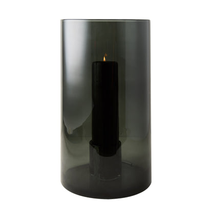 Large Diane Keaton + Hudson Grace smoke grey glass hurricane with lit black pillar candle.
