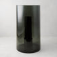 Large Diane Keaton + Hudson Grace smoke grey glass hurricane with dark pillar candle.