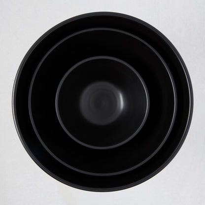 Diane Keaton + Hudson Grace matte black modern serve bowls, three sizes nested.