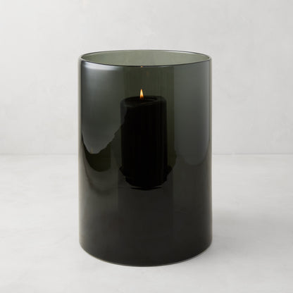 Medium Diane Keaton x Hudson Grace Smoke Grey Glass Hurricane with a lit black pillar candle.