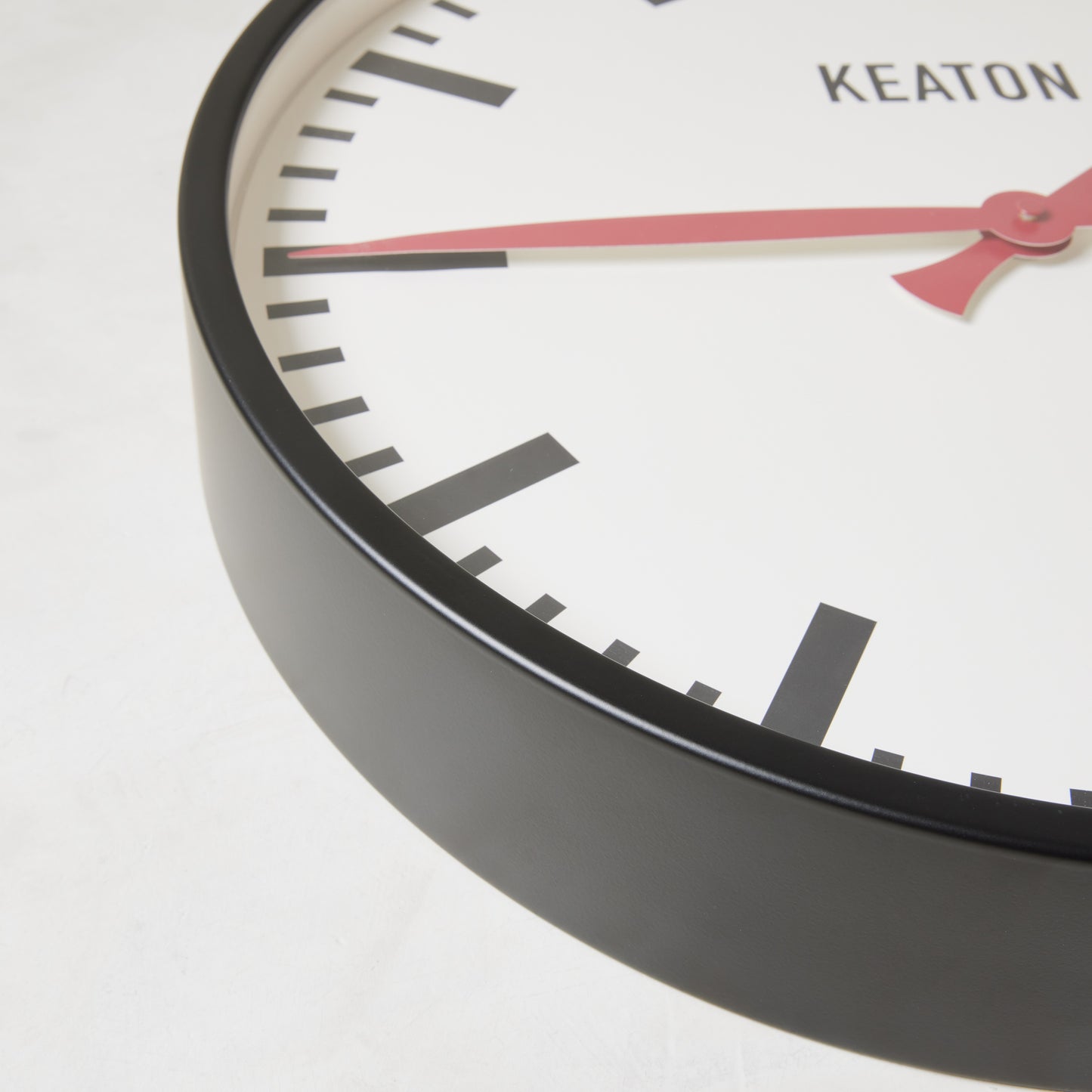 Diane Keaton + Hudson Grace Metro Wall Clock, black metal case, white dial, red hands.