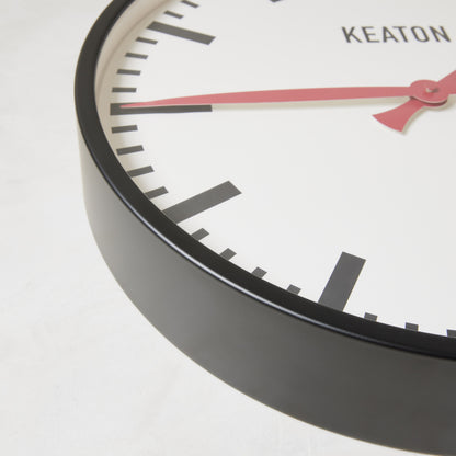 Diane Keaton + Hudson Grace Metro Wall Clock, black metal case, white dial, red hands.