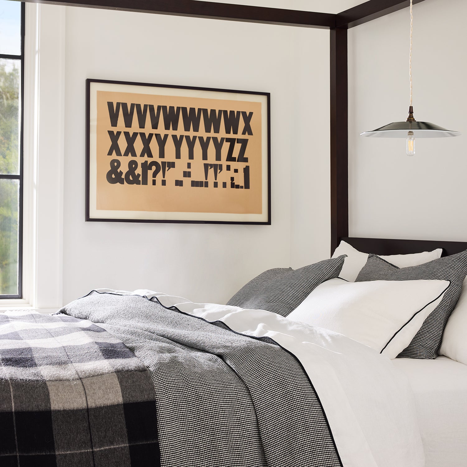 Diane Keaton + Hudson Grace black and white petite gingham linen duvet cover on a bed.