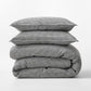 Diane Keaton + Hudson Grace black and white petite gingham linen duvet cover and shams, stacked.