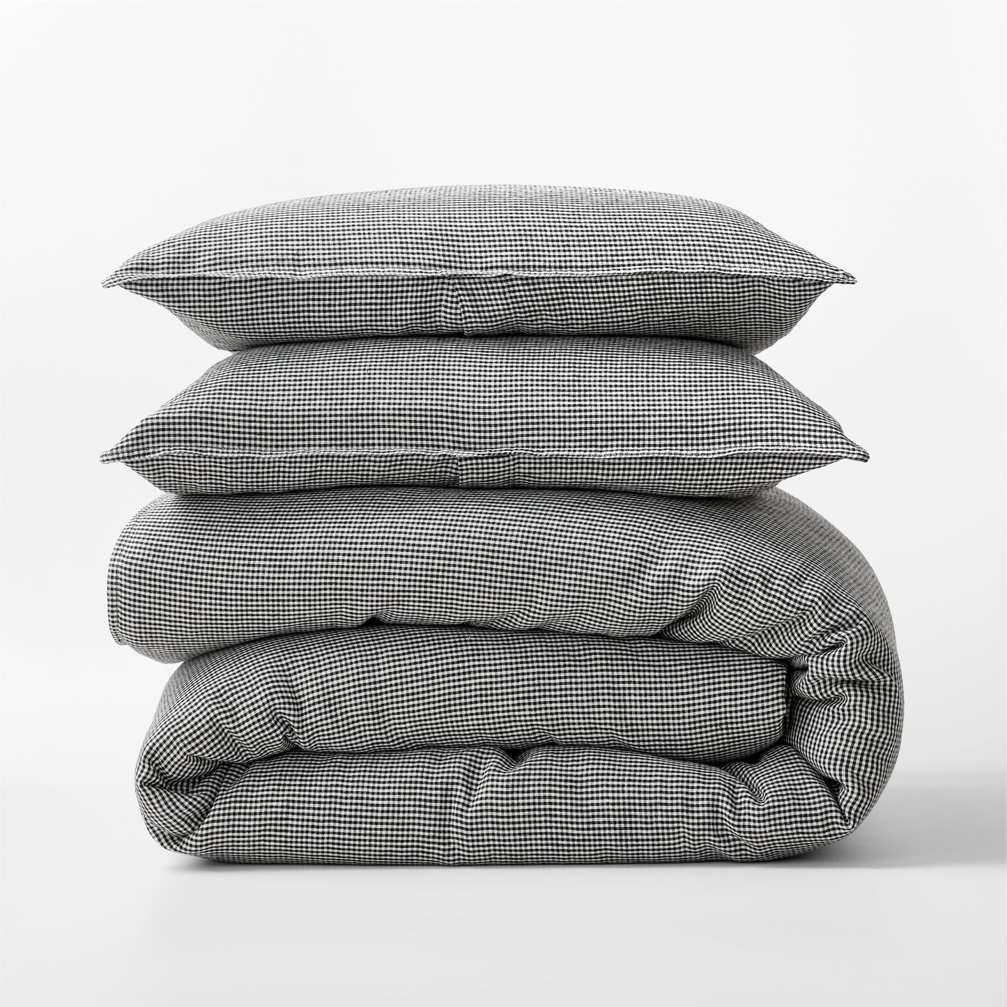 Diane Keaton + Hudson Grace black and white petite gingham linen duvet cover and shams, stacked.