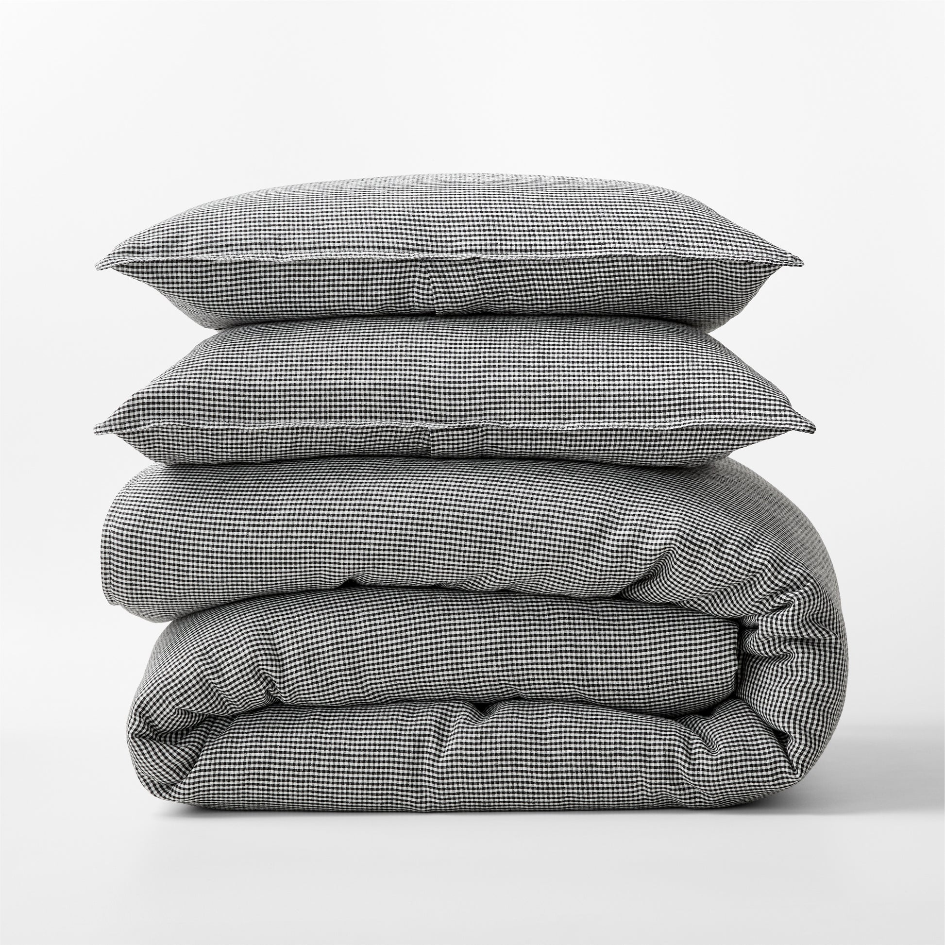 Diane Keaton + Hudson Grace black and white petite gingham linen duvet cover and shams, stacked.