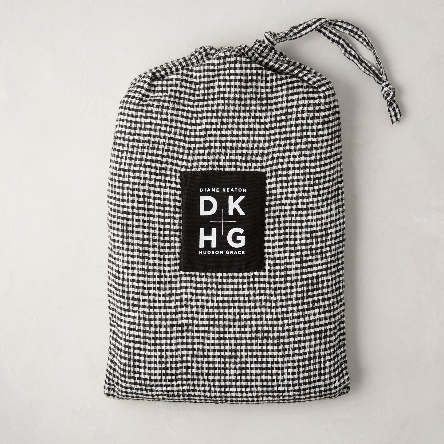 Diane Keaton + Hudson Grace petite gingham linen pillow shams in black and white drawstring bag.