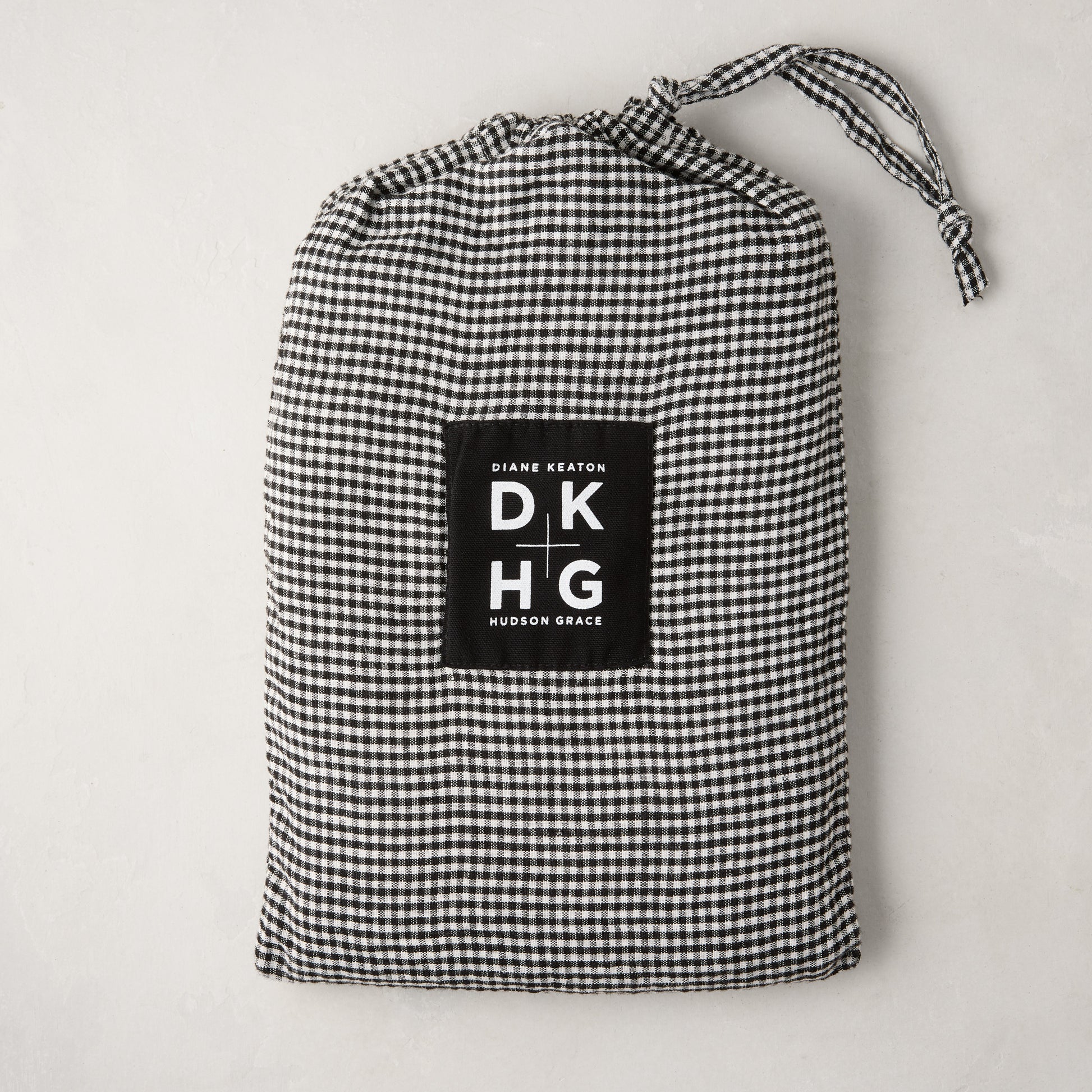 Diane Keaton + Hudson Grace petite gingham linen pillow shams in black and white drawstring bag.