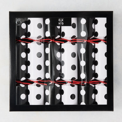 Diane Keaton + Hudson Grace polka dot Christmas crackers in black and white, tied with red string, in a black box.
