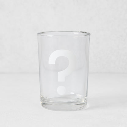 Clear glass everyday wine glass with a white question mark design.
