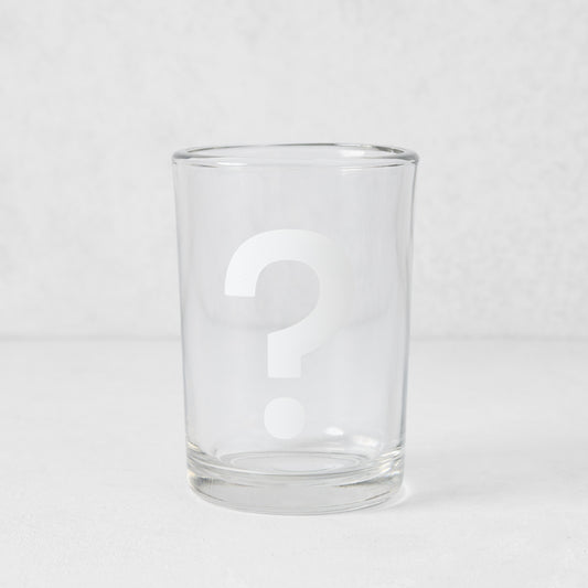 Clear glass everyday wine glass with a white question mark design.