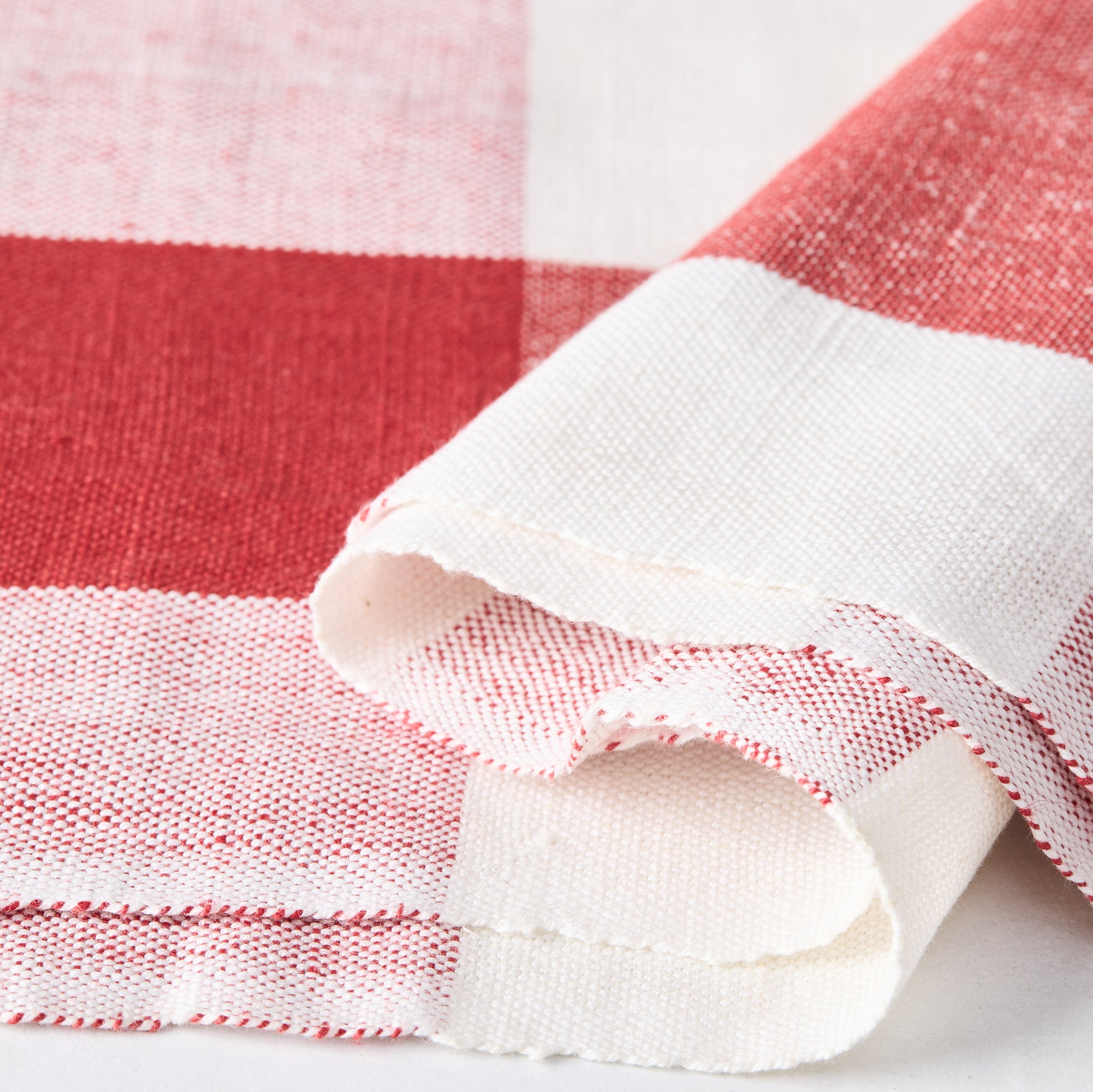 Diane Keaton + Hudson Grace red buffalo check cotton-linen hand towel, folded.