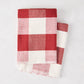 Diane Keaton + Hudson Grace red buffalo check cotton-linen hand towels, set of 2, folded.