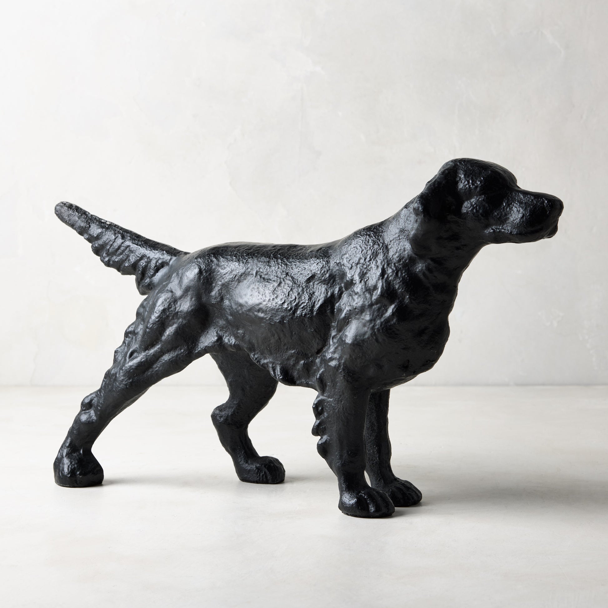 Diane Keaton x Hudson Grace "Reggie" matte black cast iron dog door stopper, antique Parisian sculpture style.