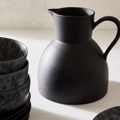 Diane Keaton + Hudson Grace sculptural black stoneware pitcher with a matte finish.