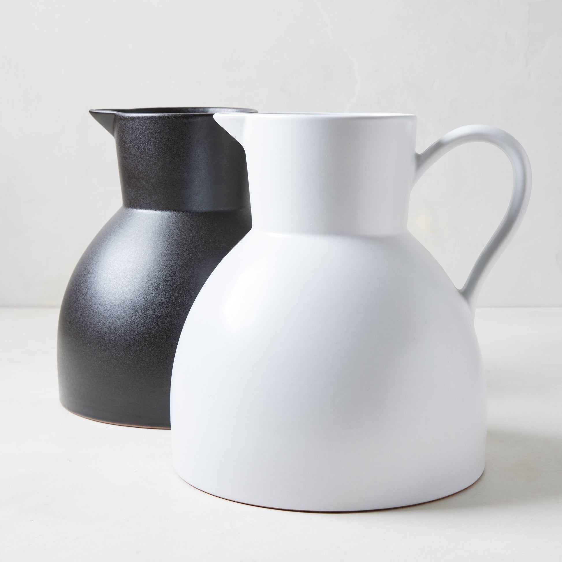 Diane Keaton + Hudson Grace sculptural black and white stoneware pitchers.