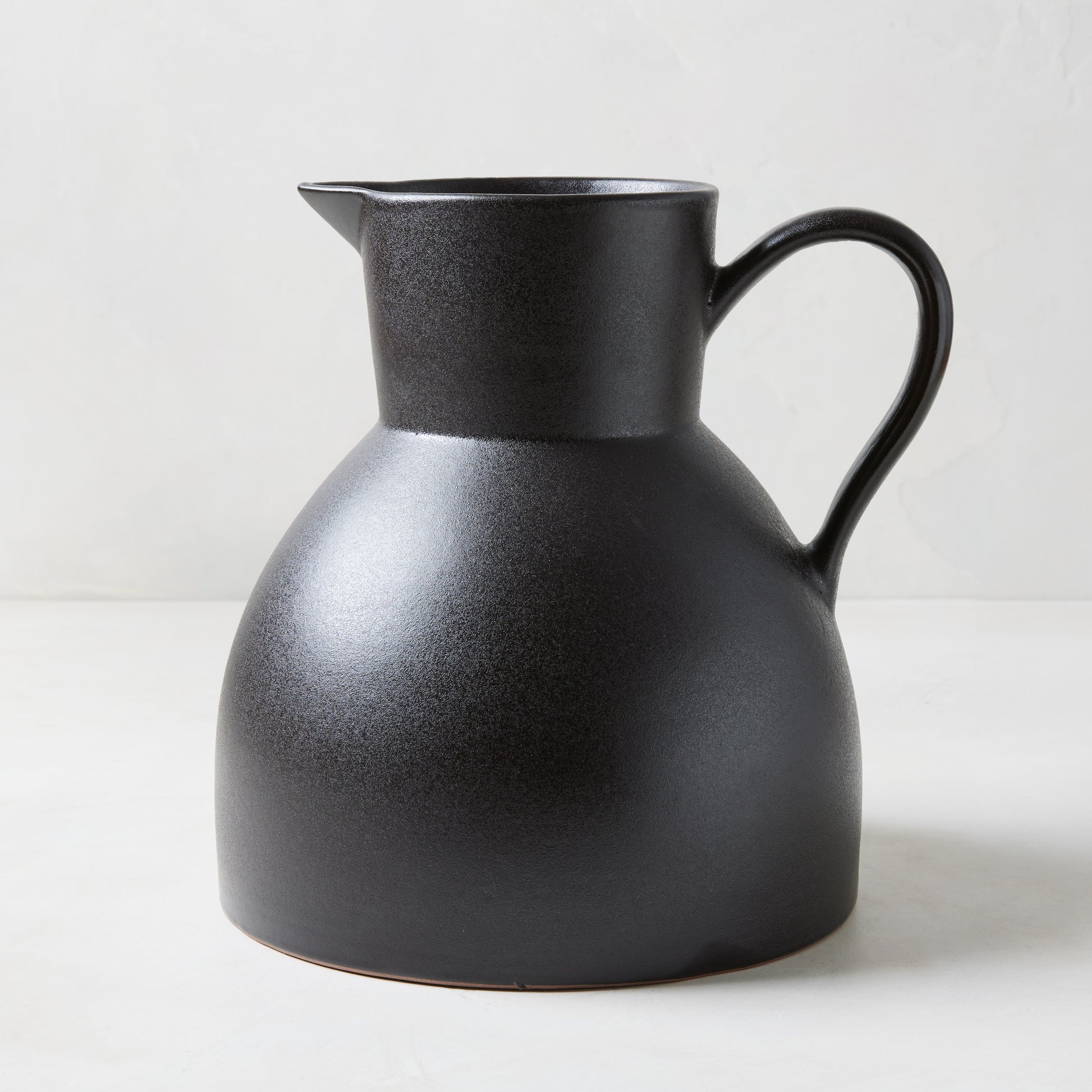 Diane Keaton + Hudson Grace sculptural black stoneware pitcher, oversized and handcrafted.