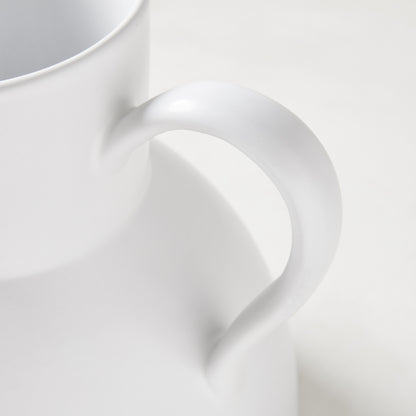 Diane Keaton + Hudson Grace sculptural white stoneware pitcher, close-up of handle.